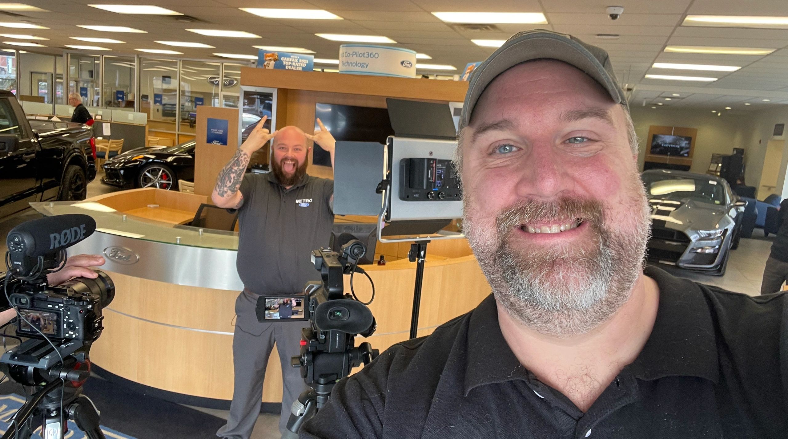 KWB Media crew filming at a car dealership
