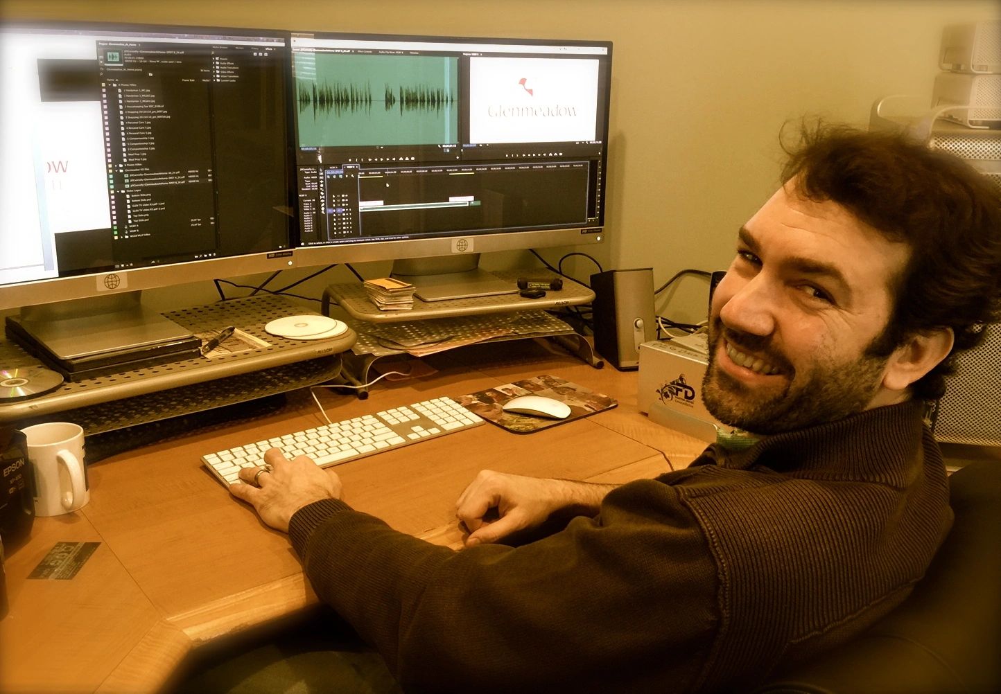 Smiling KWB Media editor at the post production editing suite