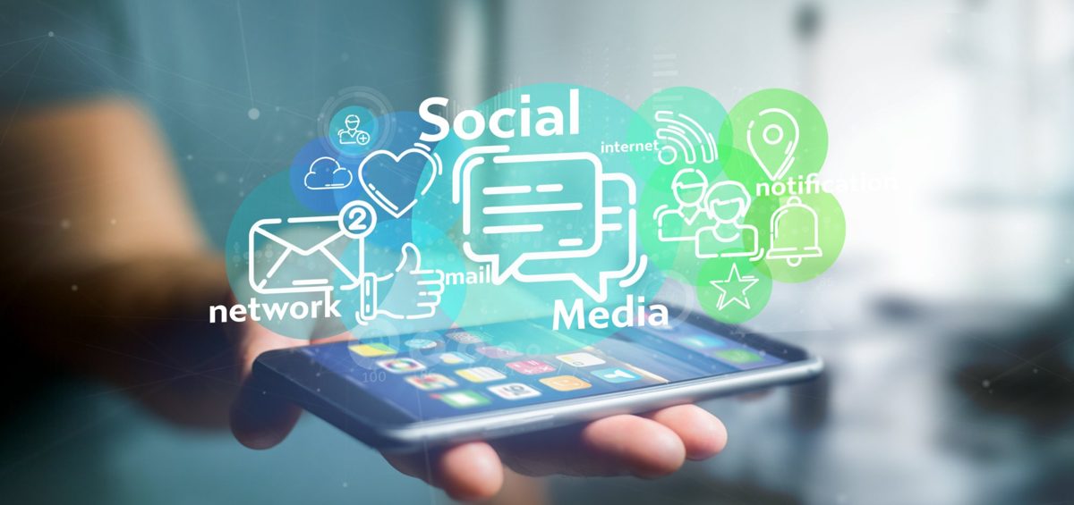 Social media icons floating above a smartphone